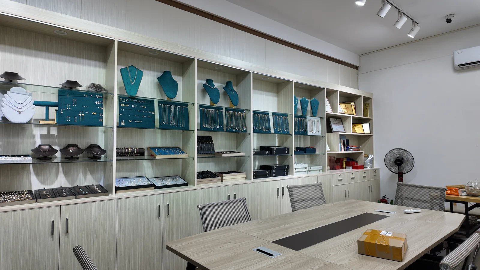 Showroom with glass display cases of finished jewelry