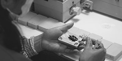 Quality check of a 925 sterling silver jewelry component at the workbench