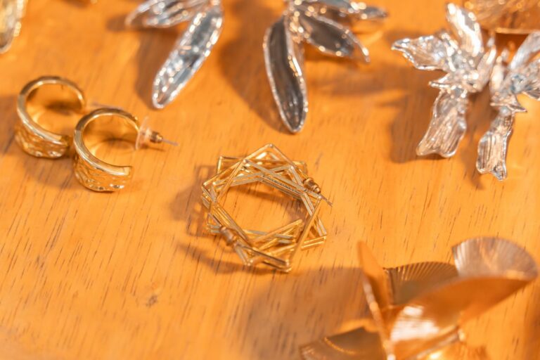 18K gold plated and 925 sterling silver jewelry pieces side by side for material comparison
