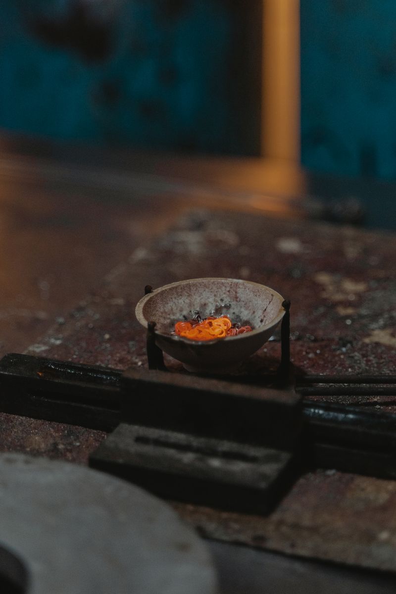 Molten silver glowing in a crucible during the jewelry casting process
