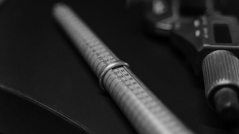 Ring sizer stick and digital caliper used to check 925 sterling silver ring sizes