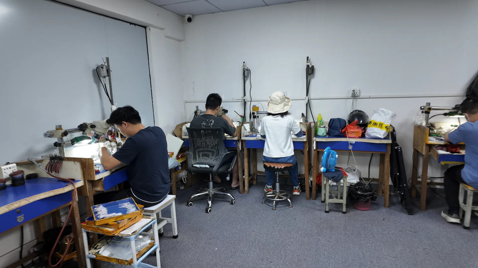 Hand assembly of jewelry components at a workbench